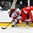 GRAND FORKS, NORTH DAKOTA - APRIL 22: Denmark's David Madsen #14 gets a kneeing penalty against Latvia's Markuss Komuls #2 during relegation round action at the 2016 IIHF Ice Hockey U18 World Championship. (Photo by Matt Zambonin/HHOF-IIHF Images)

